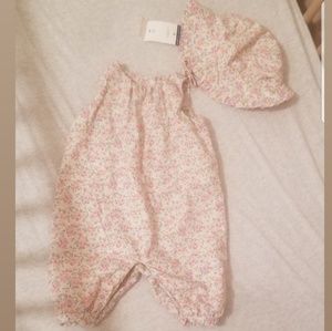 Floral romper and sun hat.
